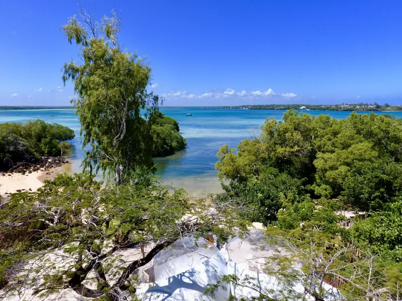 The Lagoon Bubble Lodge with its private terrace above the turquoise water of Mida Creek