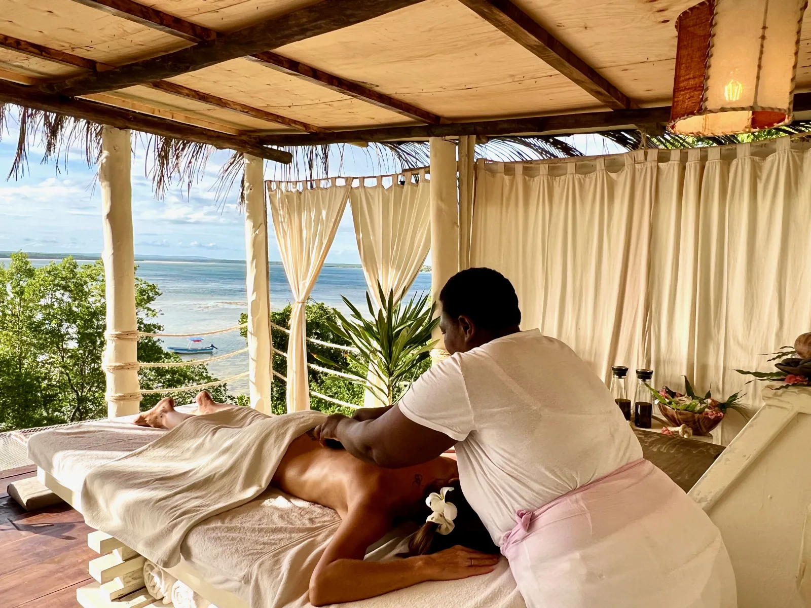 A massage in the open-sided spa pavilion overlooking the creek